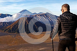 Man traveler against the Bromo volcano. Indonesia. Java island