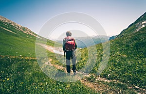 Man Traveler with backpack hiking outdoor Travel Lifestyle