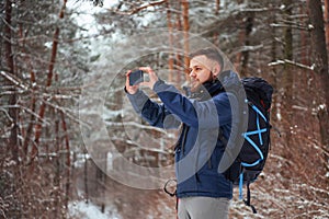 Man Traveler with backpack hiking Travel Lifestyle adventure concept active vacations outdoor. Beautiful landscape