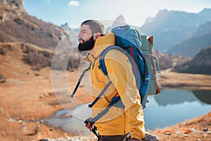 Man Traveler with backpack mountaineering .