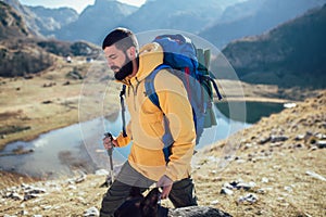 Man Traveler with backpack mountaineering .