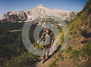 Man Traveler with backpack mountaineering Travel