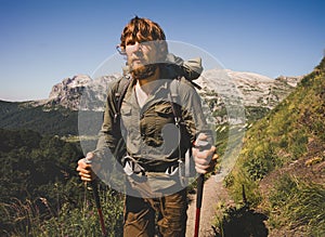 Man Traveler bearded with backpack mountaineering