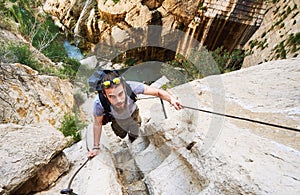 Man traveler climbing up a stepped mountain road. Spain