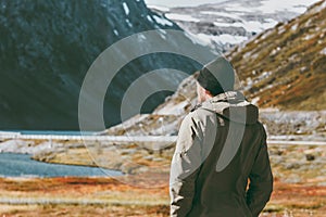 Man traveler enjoying scandinavian mountains