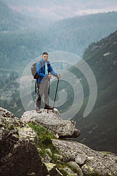 Man Traveler on mountain summit enjoying aerial view. Slovakia, Europe.