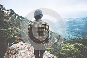 Man Traveler standing on cliff alone aerial view