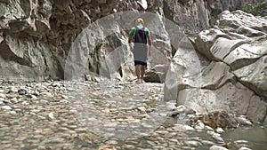 Man traveler during walk in Canyon Saklikent inside view