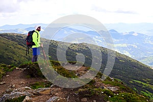 Man traveling with backpack hiking in mountains Travel Lifestyle success concept adventure active vacations outdoor