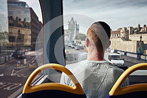 Man traveling by bus in London