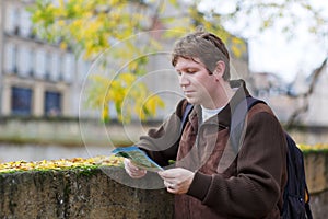 Man traveling and looking at the travel city map