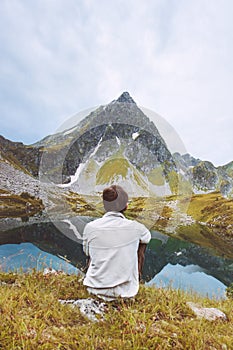 Man traveling relaxing alone with lake view adventure vacations