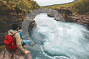 Man traveling relaxing alone with river canyon view