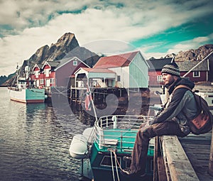Man traveller in Reine village, Norway photo