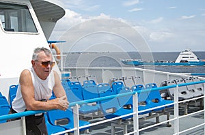 Man travelling on ferry photo