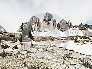 Man trekking in the Alps. Mountain ridge of Tre Cime