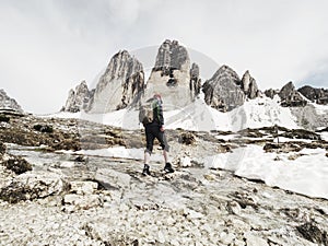 Man trekking in the Alps. Mountain ridge of Tre Cime