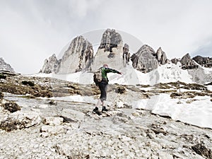 Man trekking in the Alps. Mountain ridge of Tre Cime