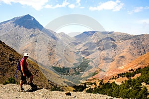 Man trekking in atlas mountains, morocco photo