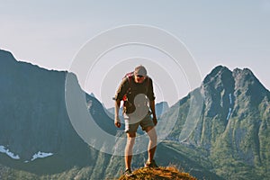 Man trekking in mountains backpacking travel vacations outdoor