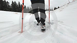 Man trekking snowy mountain in winter