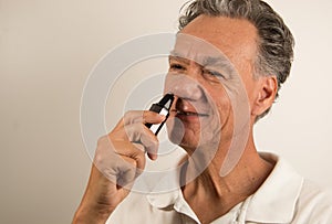 Man Trimming his Nose Hairs