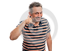 Man with trustworthy expression making call gesture using fingers