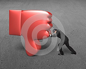 Man try to push down red 3D thumb down