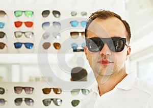 Man trying on new sunglasses at the opticians