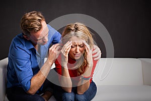 Man trying to calm his girlfriend down