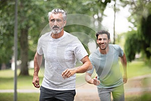 man trying to catch up with older running companion
