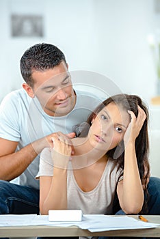 Man trying to comfort sad woman