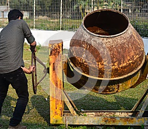 Man is trying to move the construction machine stock photograph photo