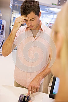 Man trying to remember card PIN number