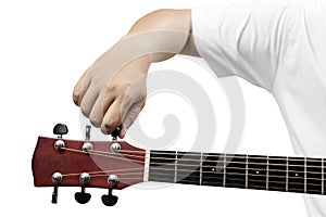 Man tuning guitar string