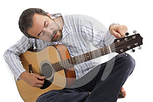 Man tuning his guitar