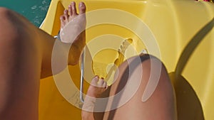 The man turns the pedals on the catamaran. swimming in the high seas ocean water