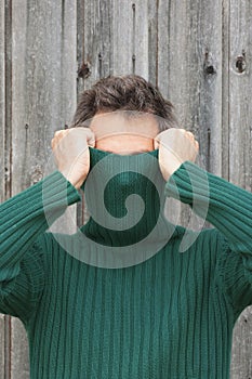 Man with turtleneck covering face photo