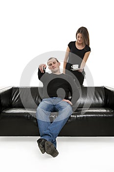 Man with tv remote control and woman beside