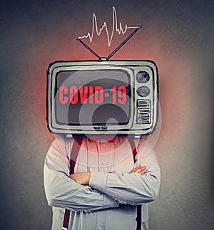 Man with TV set instead of a head watching Coronavirus news