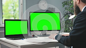 Man with two chroma key computers