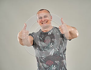 Man with two thumbs up