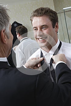 Man Tying Groom's Bow Tie