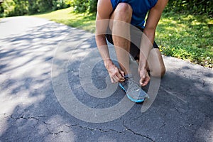 Man Tying His Shoelace