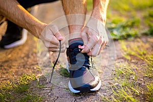 Man tying running shoes. Healthy lifestyle