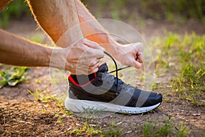 Man tying running shoes. Healthy lifestyle