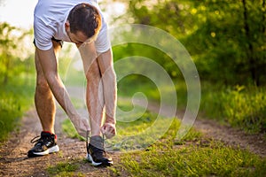 Man tying running shoes. Healthy lifestyle