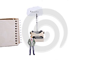 Man typewriter and a spiral notebook