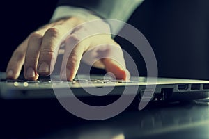 Man typing on a computer
