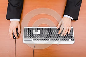 Man typing in the computer